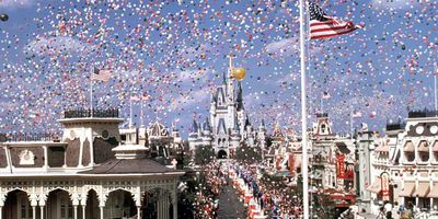 Cinderella castle and a crowd of guests at the grand opening of Walt Disney World in 1971.